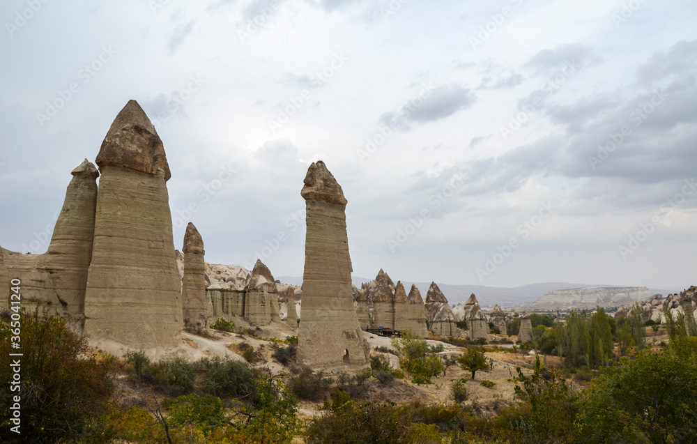 Famous rock formations in Love Valley in Cappadocia, a historical region in Central Anatolia in Turkey