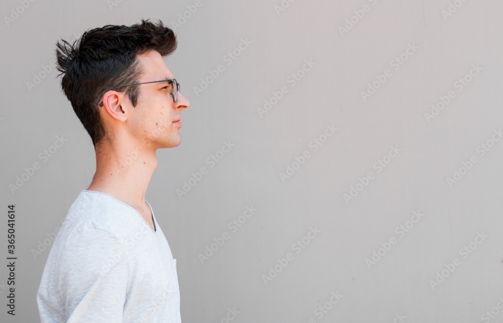 Close-up profile portrait of handsome smiling young man Close-up profile portrait of handsome smiling young man
