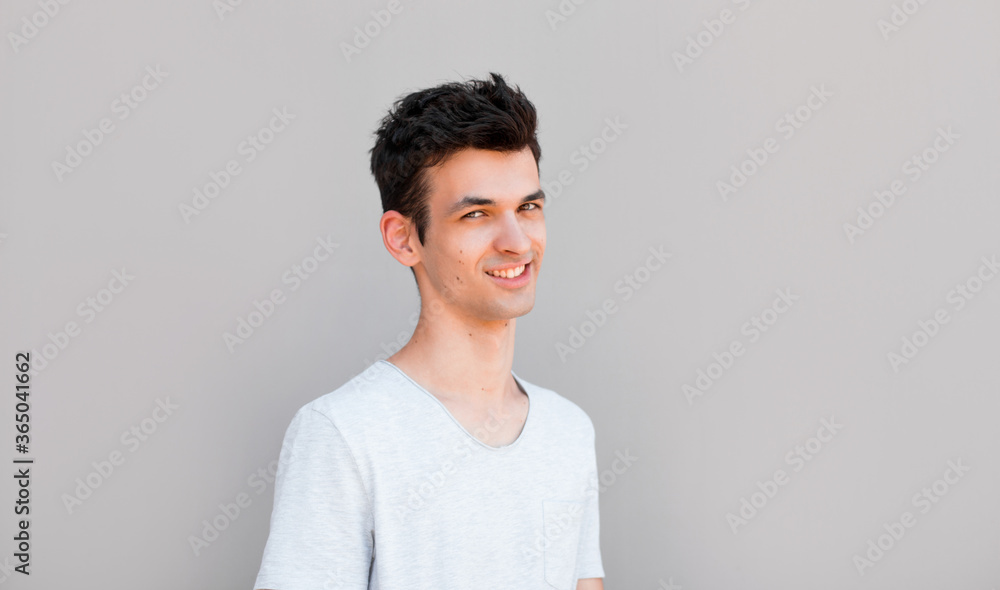 Good looking man, portrait on grey background Good looking man, portrait on grey background