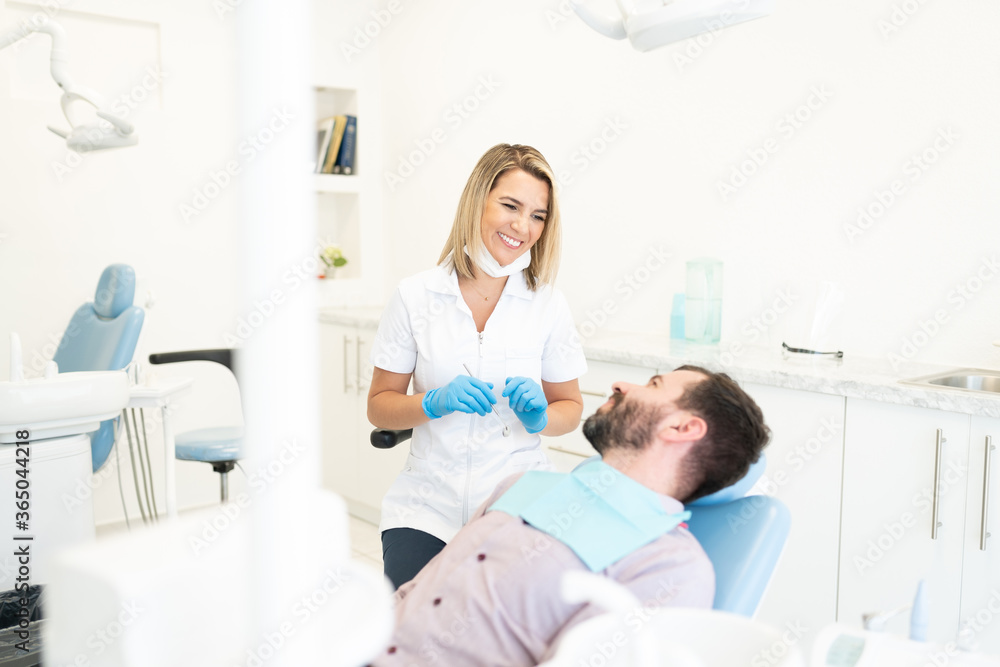 Fototapeta premium Man Visiting Dentist At Clinic