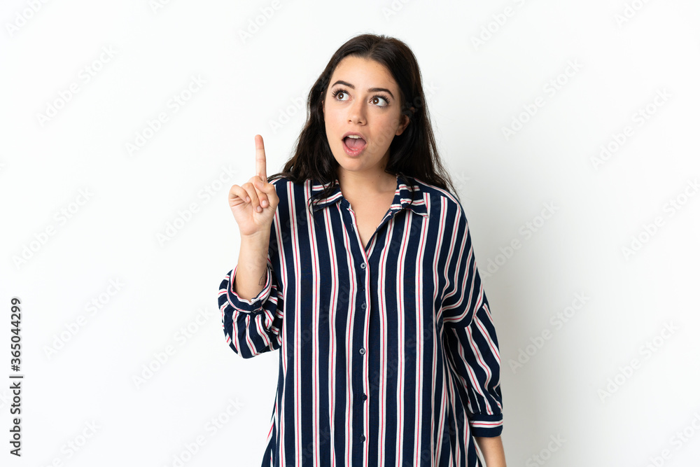 Young caucasian woman over isolated background thinking an idea pointing the finger up Young caucasian woman over isolated background thinking an idea pointing the finger up