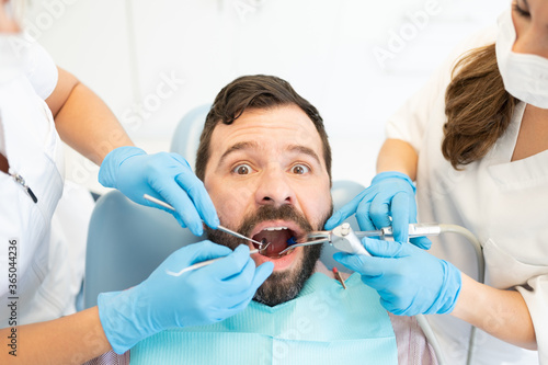 Female Dentists With Patient At Clinic