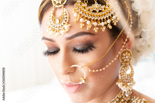 Beautiful Sikh bride wearing traditional wedding attire and jewelry