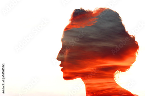 Woman with sunset clouds in her head
