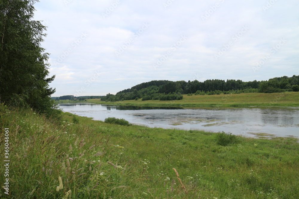Cloudy day with clouds on the river in the countryside Cloudy day with clouds on the river in the countryside