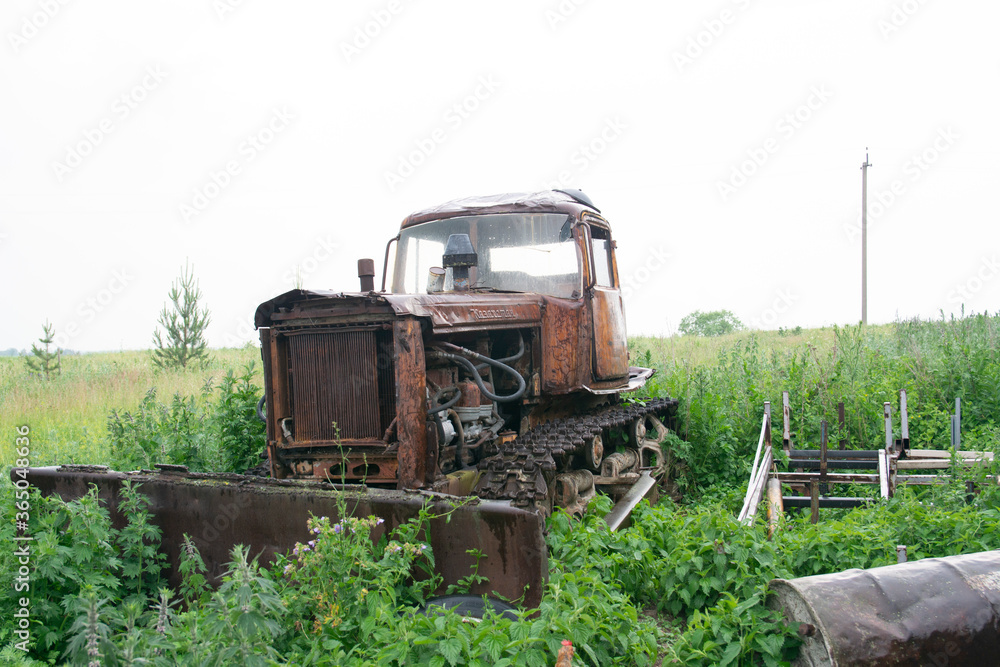 Fototapeta premium Old rusted rural farm tractor