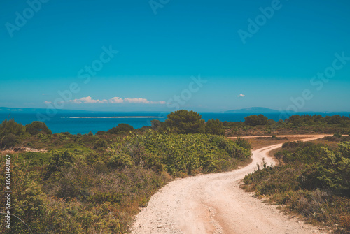 panoramic view of Kamenjak National Park, Istria, Croatia with gravel roads, rocky coast lines and islands