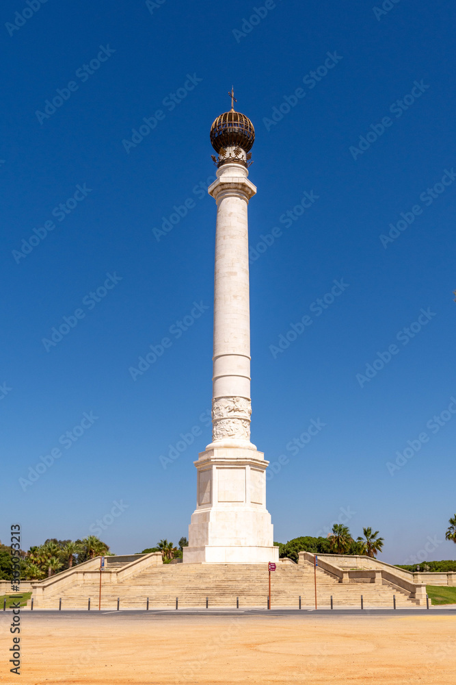Monument to the discoverers in La Rabida, Huelva. Large column with an orb at its top in an environment surrounded by gardens. Huelva, Andalusia, Spain.