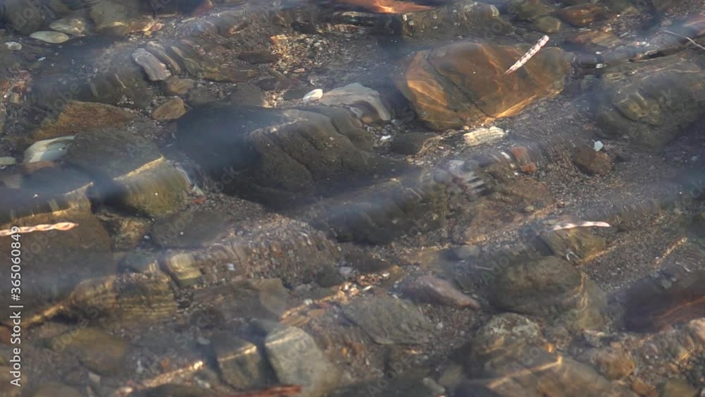 Stone seashore. Sea waves in slow motion Stone seashore. Sea waves in slow motion