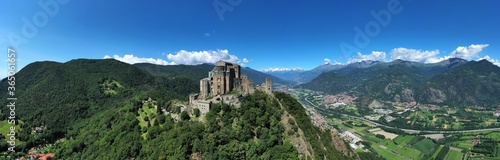 The Sacra di San Michele (Saint Michael's) Abbey, Turin, Italy, shot aerial with mountains of Susa valley in background. Aerial view