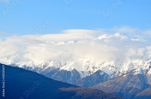 Flying clouds over the mountain tops