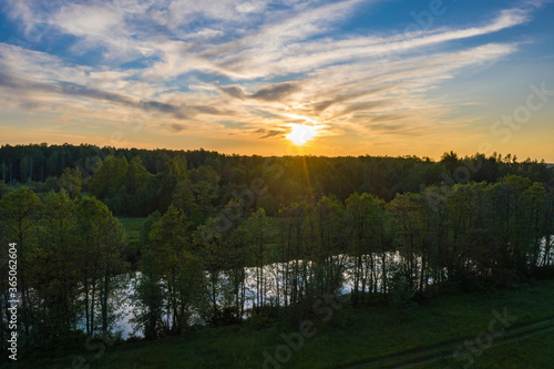 Beautiful orange sunset over the Teza river in the Ivanovo region. photo