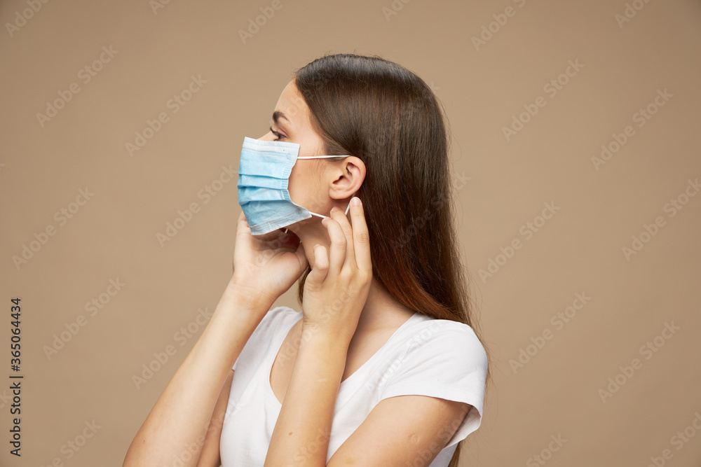 Beautiful girl in white shirt in a protective mask health Beautiful girl in white shirt in a protective mask health