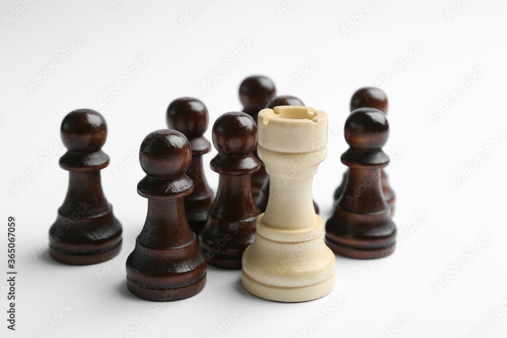 White rook with black pawns on light background. Career promotion concept White rook with black pawns on light background. Career promotion concept