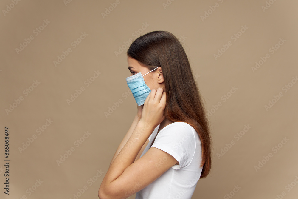 Lady in white shirt in a protective mask allergy pollution Lady in white shirt in a protective mask allergy pollution