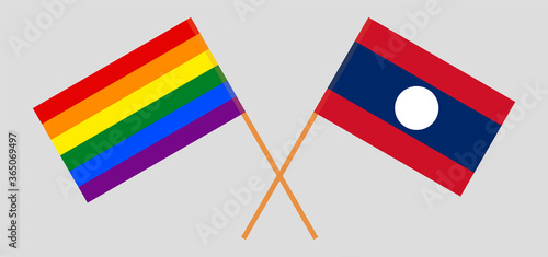 Crossed flags of LGBT and Laos