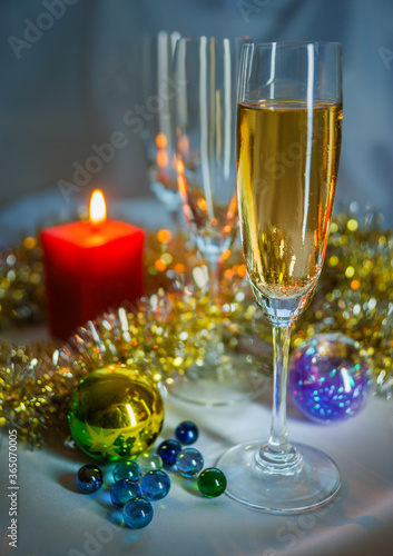 glass of champagne and christmas decorations © Igor Pyekhtyeryev