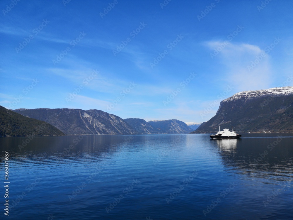 Ferry surrounded by mountains