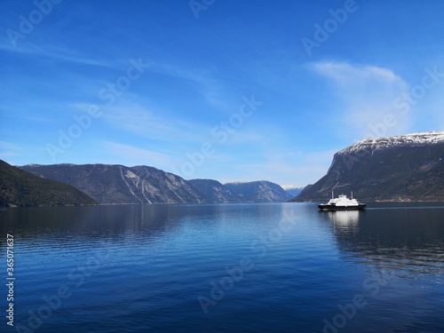 Ferry surrounded by mountains