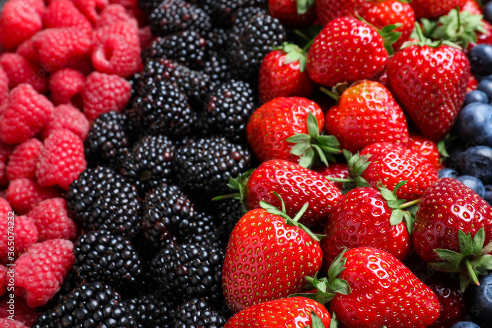 Mix of different ripe tasty berries as background, closeup view Mix of different ripe tasty berries as background, closeup view