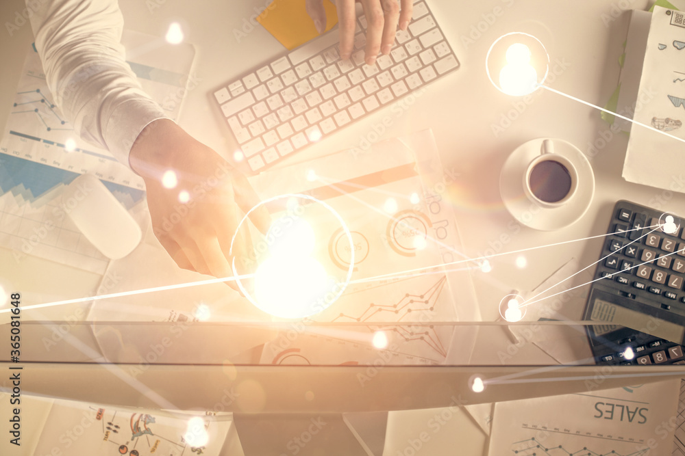 Naklejka premium Double exposure of man's hands typing over computer keyboard and social network theme hologram drawing. Top view. People connection web concept.