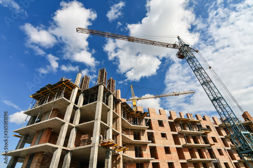Quadro su tela Residential appartment construction site with many cranes