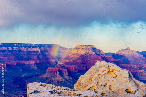 Panoramic image of the colorful rainbow over the Grand Canyon in Grand Canyon National Park from the south rim part,Arizona,USA, sunset on a sunny cloudy day with blue sky