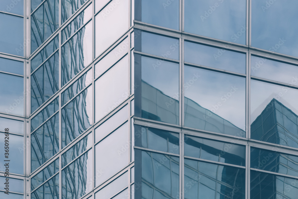 modern office glass building texture in light blue tones for business background, business center generic facade, corner view modern office glass building texture in light blue tones for business background, business center generic facade, corner view