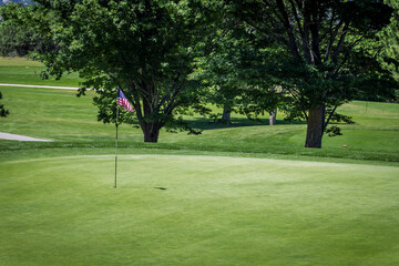 Golfing Green with American Flag Cup Flag