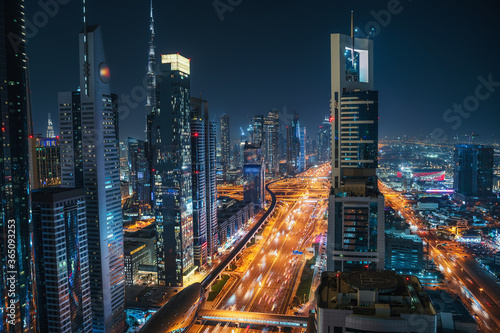 Photography Dubai skyline at night, urban skyscrapers and car traffic, view from above, United Arab Emirates