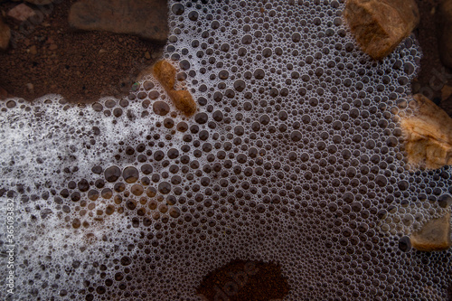 water bubbles in at shore of lake