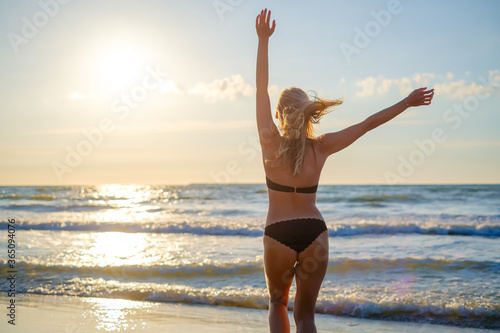 Happy woman in waving sea © Anton Gvozdikov