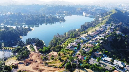 Stunning vast aerial shot over the Holly Reservoir with a hazy LA Downtown in the backdrop. 18 sec