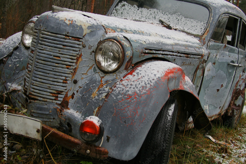 Old rusty abandoned car in the forest. Lost Old russian auto Old rusty abandoned car in the forest. Lost Old russian auto