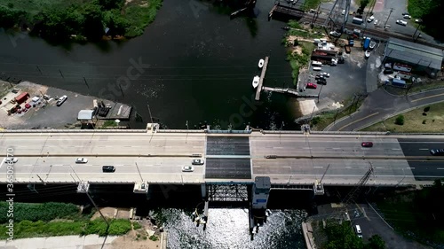 Aerial of Route 35 Morgan Bridge in Morgan, New Jersey with Cheesequake Creek and a boat marina in the background  photo