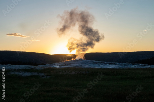 old faithful in the sunset sky