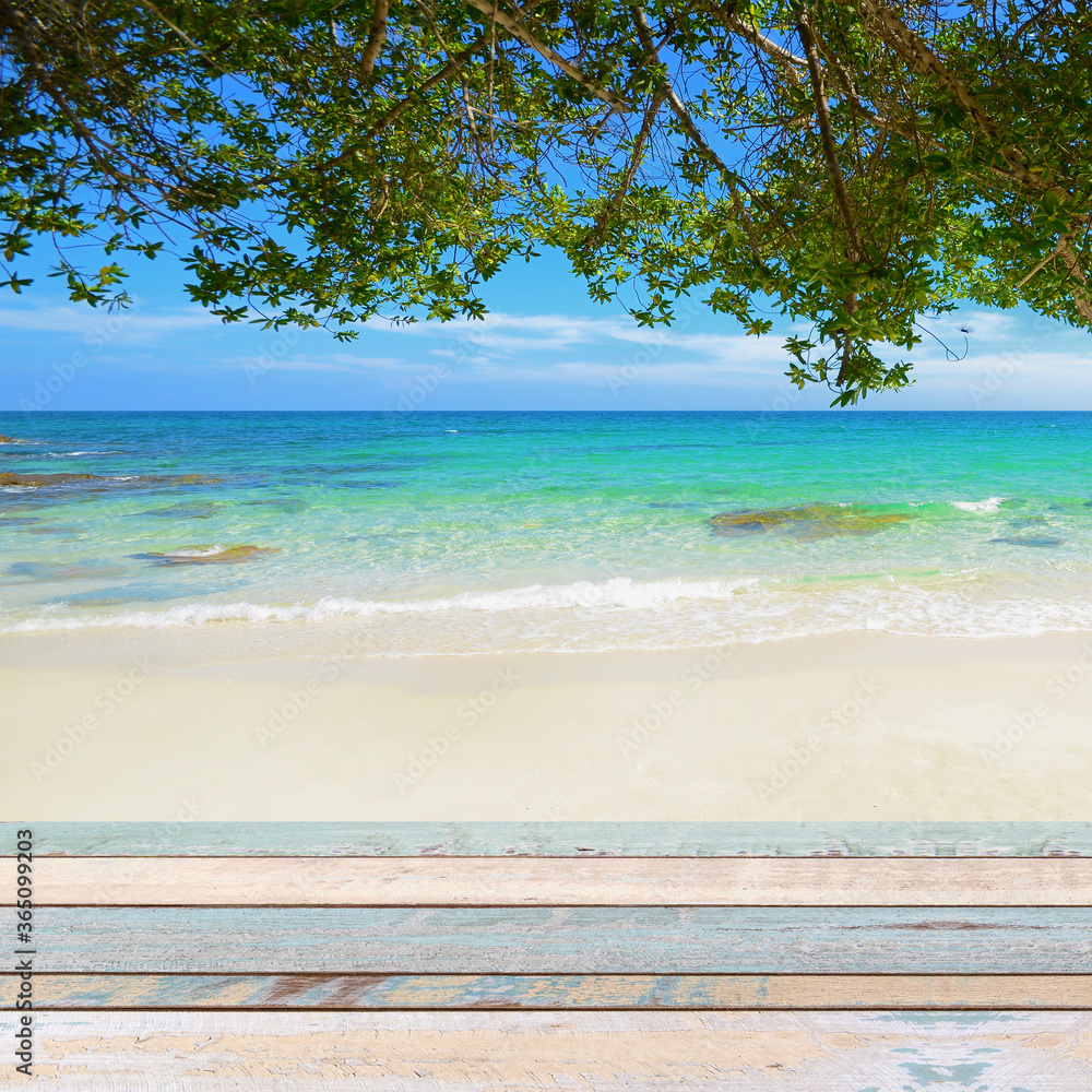 Fototapeta premium Wood table top with nature scene tropical beach
