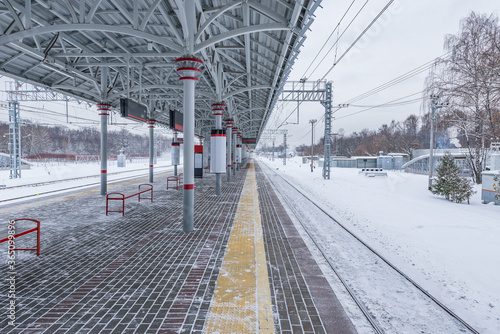 Empty passenger platform at winter day time.