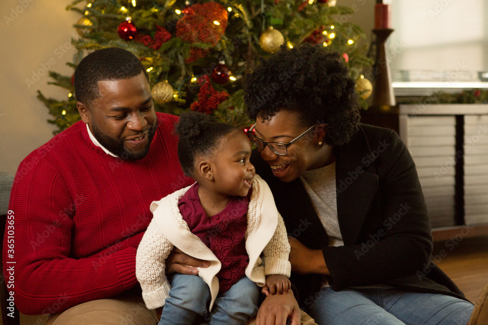 Happy African American family with their baby.