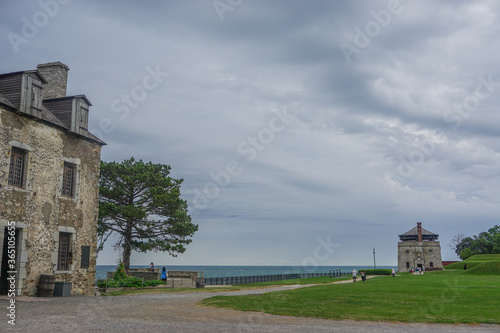 Porter, New York, USA: Visitors on the 23-acre grounds of the 18th-century Old Fort Niagara, on a cloudy day on Lake Ontario.