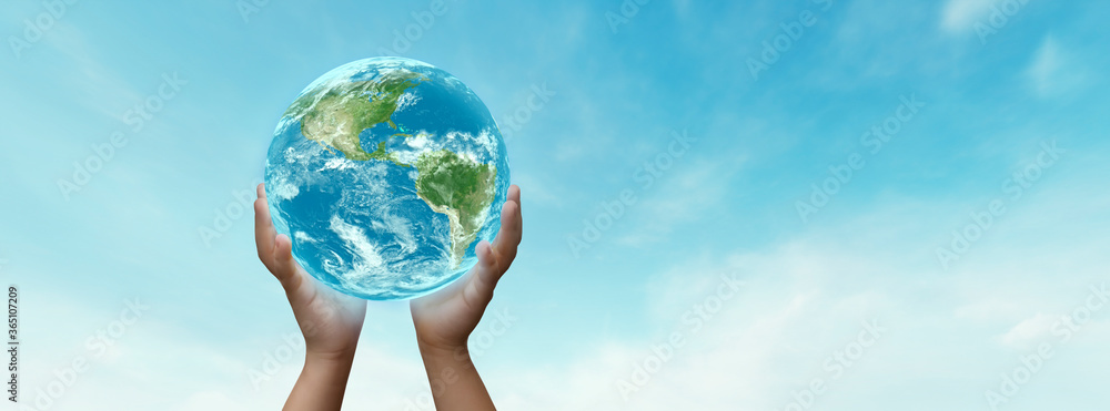 concept- boy holding planet earth in his hands- elements of this image furnished by NASA concept- boy holding planet earth in his hands- elements of this image furnished by NASA