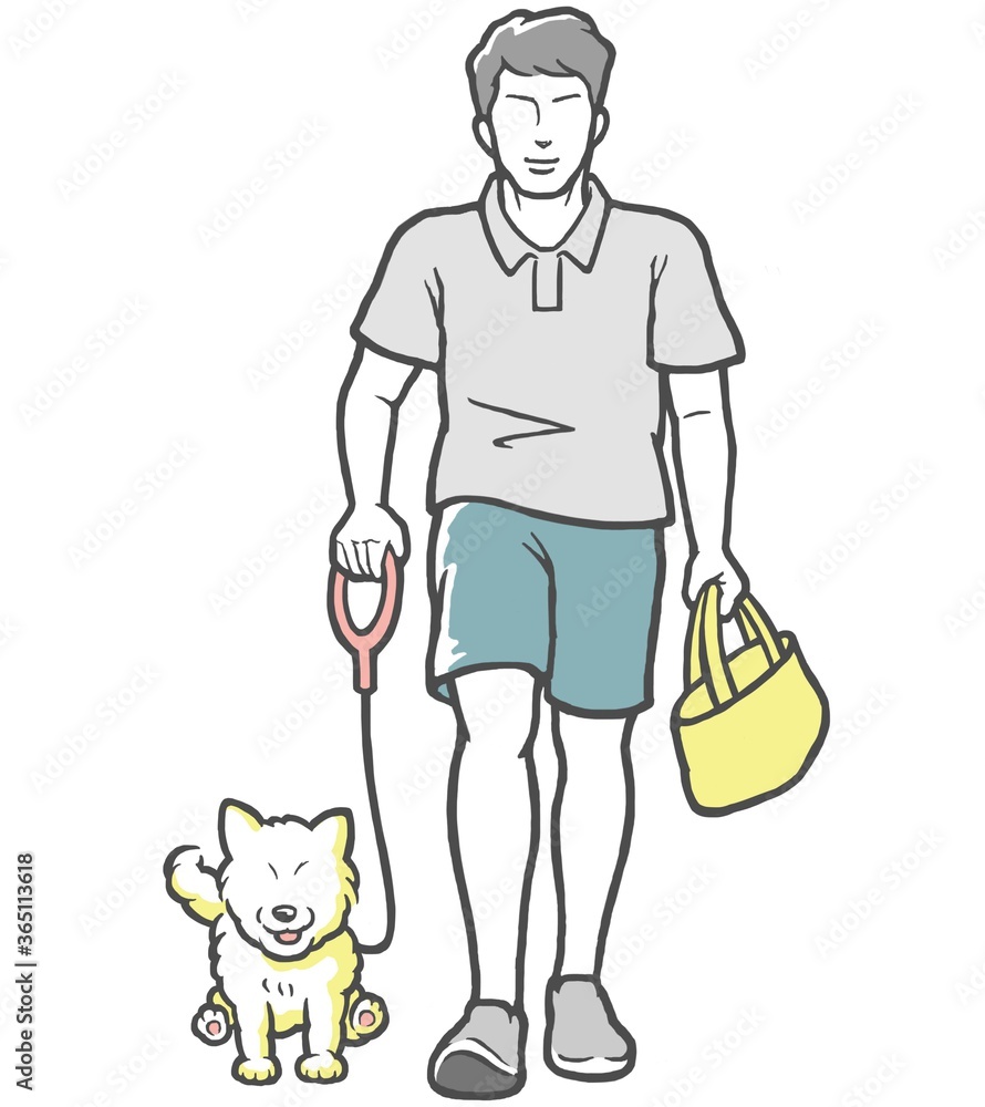 犬の散歩をする若い男性 犬の散歩をする若い男性