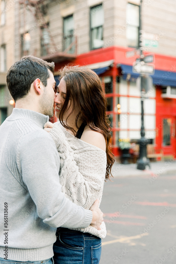 A young couple having a romantic moment in front of  famous 