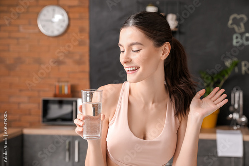 Beautiful young woman drink...