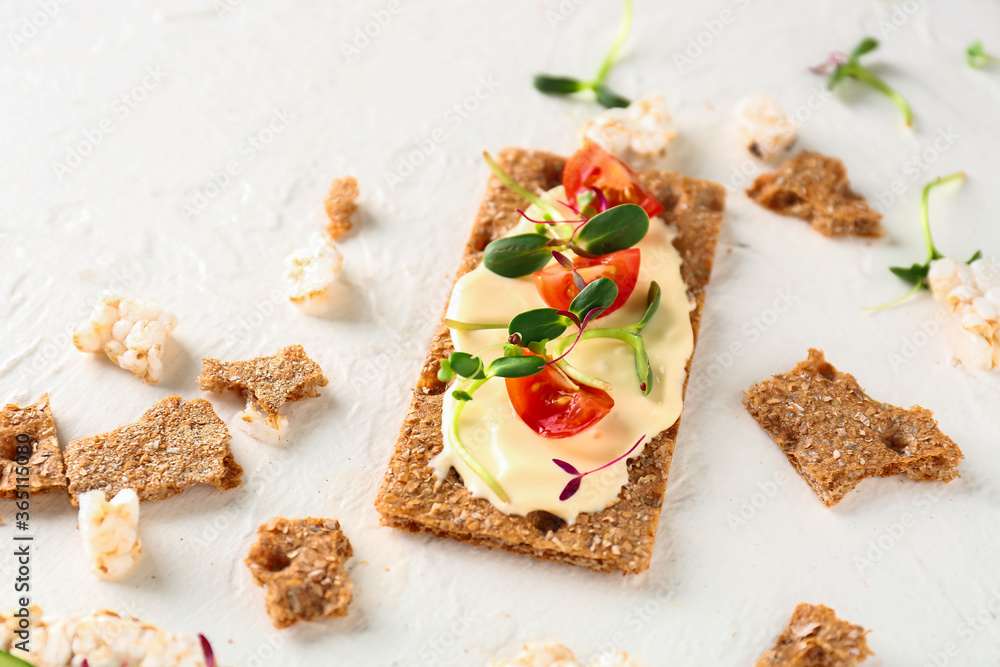 Tasty crispbread with tomato, cheese and sprouts on white background Tasty crispbread with tomato, cheese and sprouts on white background