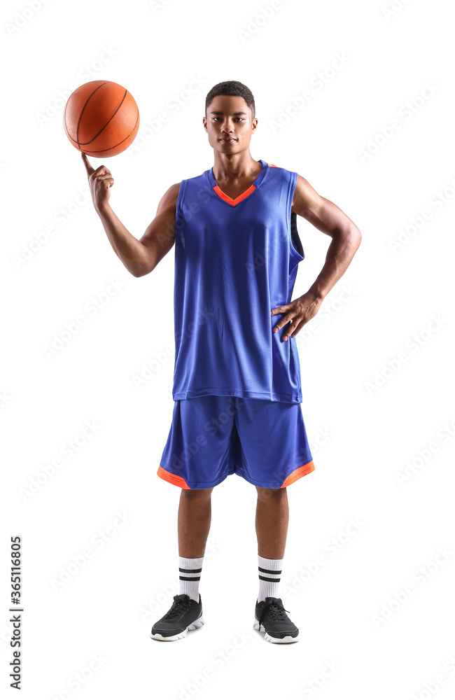 Young African-American basketball player on white background
