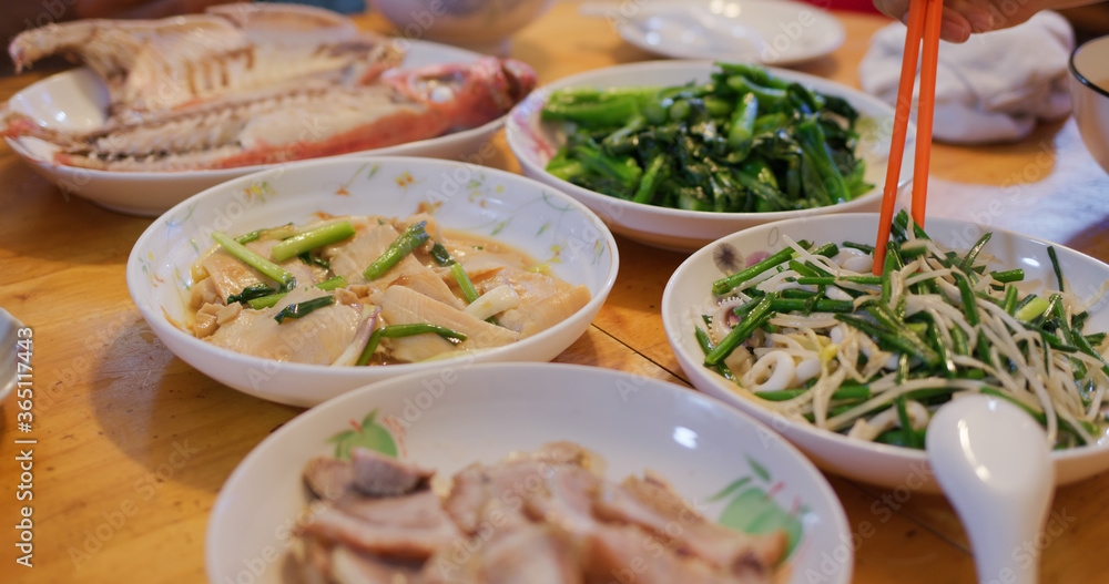 Hong Kong style home cuisine, family dinner concept, steamed fish, fry vegetable and meat