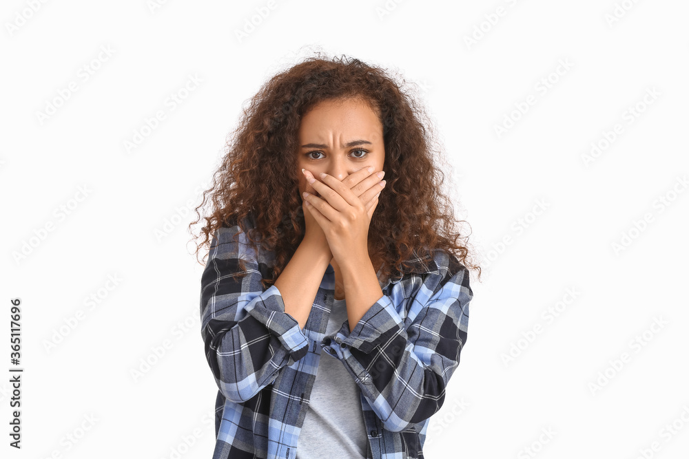 Scared African-American woman on white background. Stop racism Scared African-American woman on white background. Stop racism