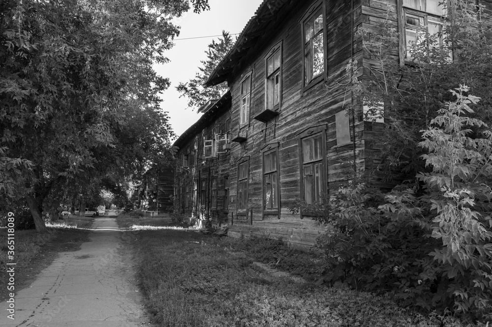 Street with old wooden houses. The concept idea for the visualization of scary or creepy stories Street with old wooden houses. The concept idea for the visualization of scary or creepy stories