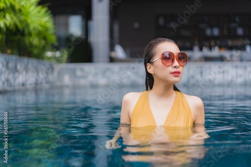 Portrait beautiful young asian woman relax leisure around swimming pool